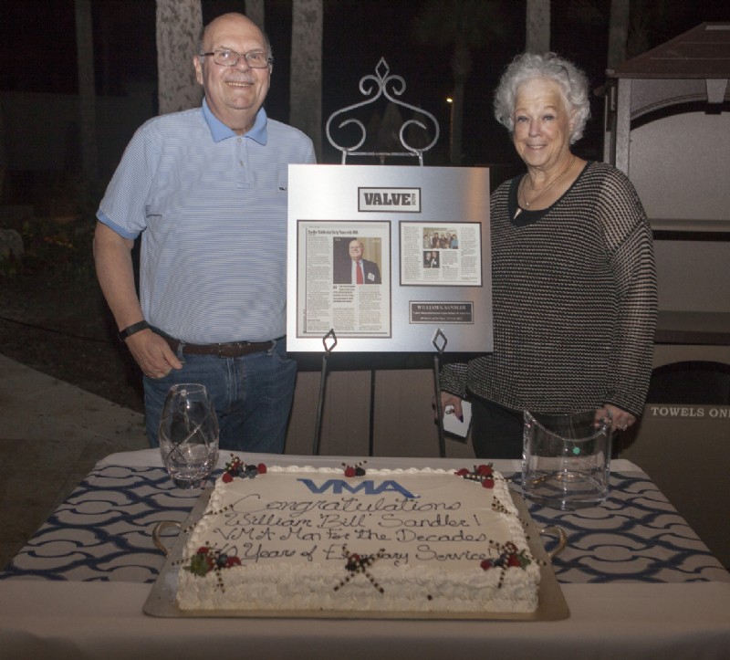 VMA President Bill Sandler was named Man for the Decades. Here he poses with his awards and a 40th anniversary cake along with Ellen Sandler, who was also recognized.